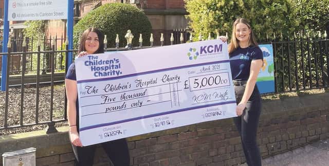 Natalie Higgins, finance manager, and Hannah Baker, marketing and communications executive, presenting the cheque to Sheffield Children’s Hospital.