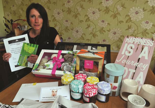 Marnie Havard from Harthill with some of the items which will be auctioned off on Friday night. 171741-2