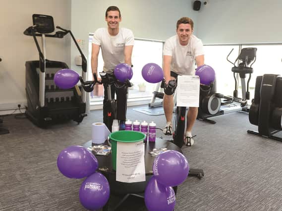 Adam White, club manager and Chris Jenks, membership consultant; are seen during the bike ride