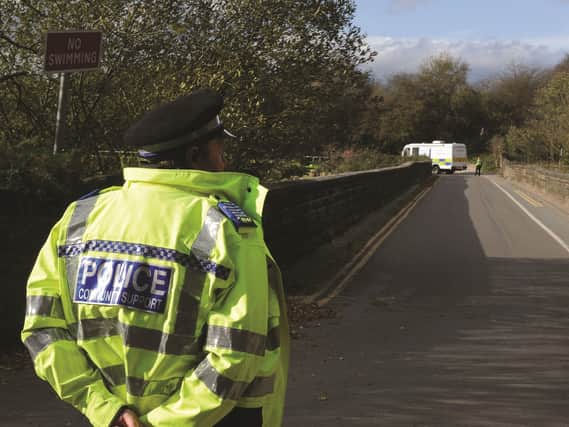 A police officer at Ulley Country Park following the attack