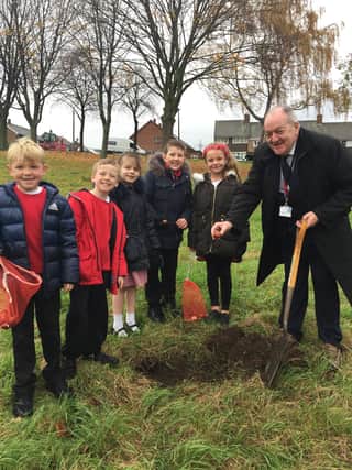 Brinsworth councillor Nigel Simpson joins pupils from Brinsworth Manor Primary School on their bulb planting session