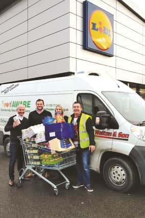 Left to right: Paul Trigg, Lidl area manager; Craig Stewart, Lidl head of sales; Amy Johnson, Lidl Mexborough store manager; and Sean Gibbons, managing director of Food AWARE.