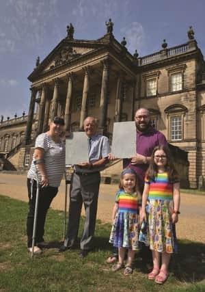 Robert White (second left) and David Harker pictured with their engaved slates, after winning a Father's Day competition run in the Rotherham Advertiser by the Wentworth Woodhouse 'Make Your Mark in History' campaign. They are seen with their daughters Kerry White (left) Ruby Harker (right) and Esme Harker. 184150-2
