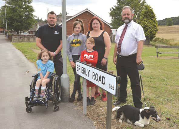 campaigner Mick Sylvester with Brierley Road residents Joanne and Kieron McCreath and their children Reece (left), Ellie and Archie. 184178-2