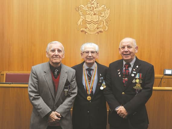 Korean War veteran, Frank Glossop, was recently presented with the Korean Peace Medal by the Mayor of Rotherham, at a ceremony at the Town Hall. Mr Glossop is seen with his brothers (left) Colin Glossop and Harold Glossop, who also served in the Armed Forces. 184746-6