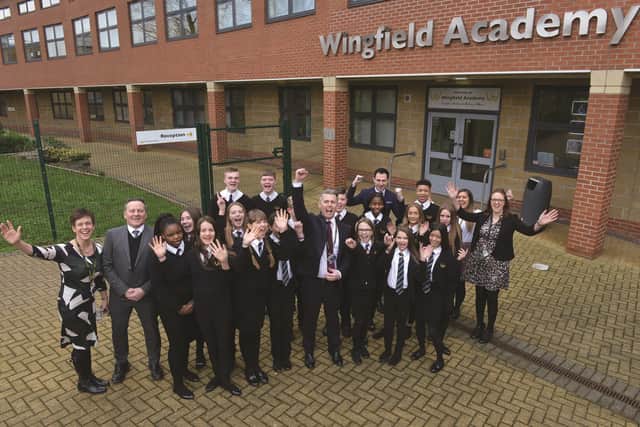 Headteacher Phil Davies (centre) with staff and students at Wingfield Academy