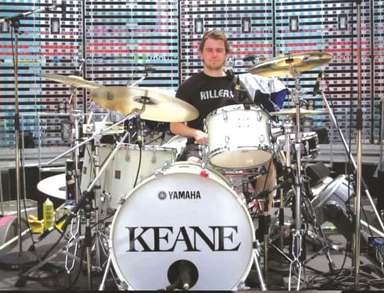 Scott at the Keane drumkit wearing a Killers T-shirt