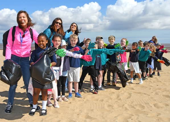 Trinity Croft CofE Primary Academy litter clearing on Cleethorpes beach. Pictured is teacher Maria Allen with Caroline Pudner from Cornerstones Education. Picture by David Harrison.