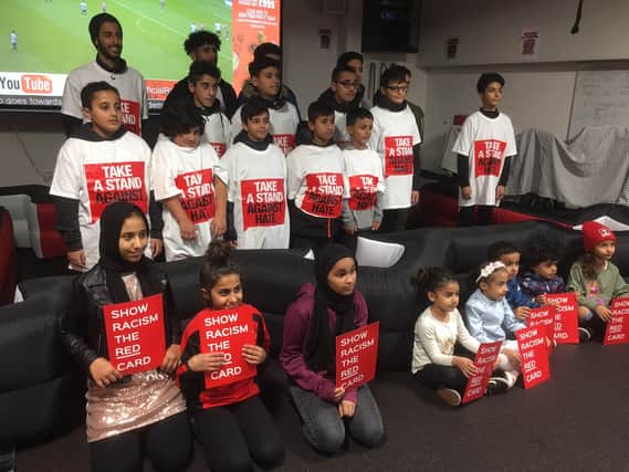 Children have been taking a stand against racism in football, alongside the police and Rotherham FC.