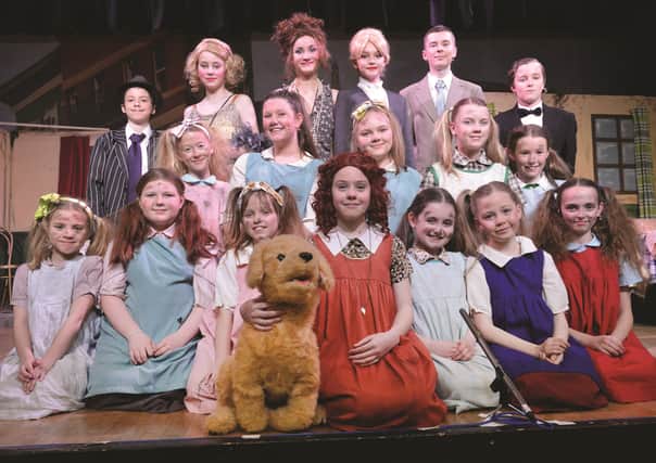 The principal cast of Annie, Jr