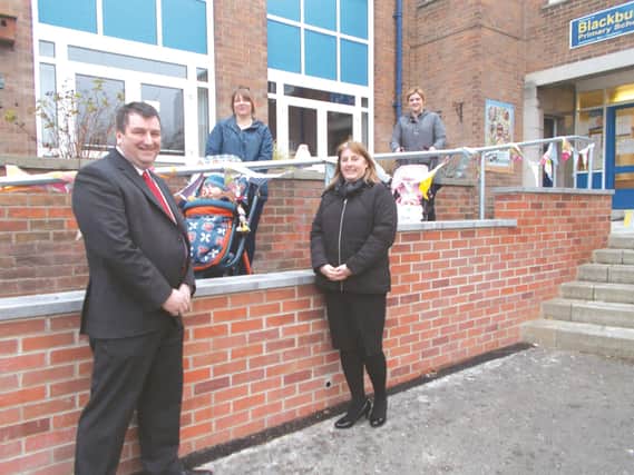 Cllr Ian Jones and head teacher Jane Sanderson (third left) with parents Layla Richards (right) and Rebecca Stanbra