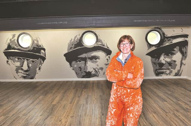 Portrait artist, Diane Benn, with her unique mural in the newly refurbished Swallownest Miners Welfare Club. 170656-4