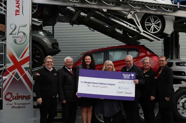 Martyn Wood and Isla Gill from Transporter Engineer (2nd and 3rd from left) with the Quinns Car Transport team Laura Quinn (1st left) and from 4th left: Sue Quinn, Tony Quinn, Sam Dunmow and Abigail Mosley