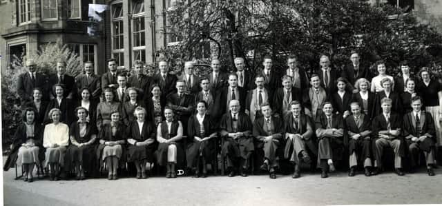 John Fisher is 4th from right, front ro, in this picture from 1953