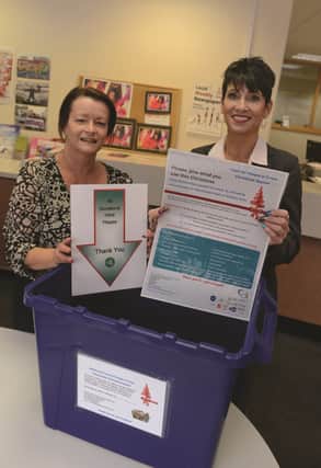 The Rotherham Advertier office on Howard Street is one of the drop-off points for the Food for People in Crisis appeal. Pictured are Andrea Cox, of FiC, and Advertiser office manager Debbie Grainger.