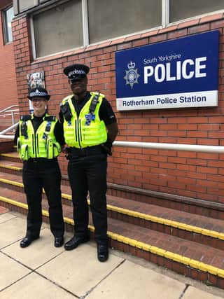Pictured is PC Kelk and PC Mpundu outside of Rotherham station.