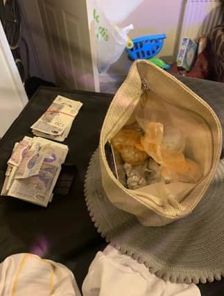 The cash and drugs found in the raid.