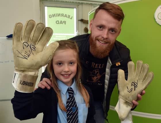 Viktor Johansson, dropped by to present her with some of his signed gloves
