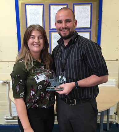 Steven McArdle being presented with his award by PK Education's Georgina Cornelius.
