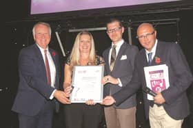 Trust chairman Martin Havenhand (L), Heart DJ Dixie (R) and Advertiser health reporter Dave Doyle present Kelly Guest with her award.