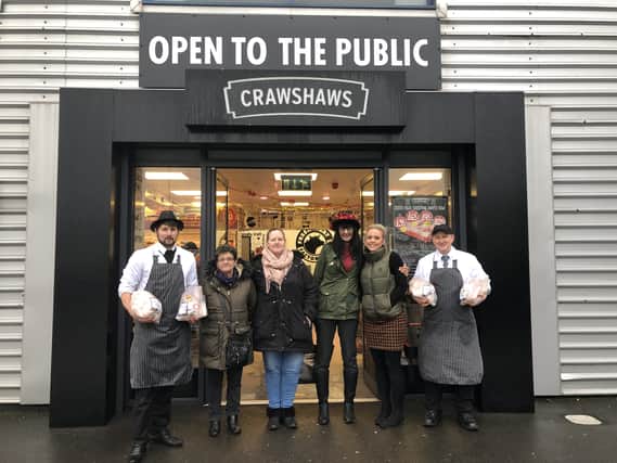 Crawshaws staff Luke Turner (left), Amy Tomlinson (second from right) and Pete May (right) with Maltby Town Council representatives Pauline Heaps, Donna Sutton and Shaz Biggin.