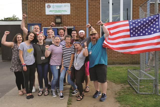 Adam and Rebecca Lynch (back left) who founded the Love Mexborough group along with American visitors from Richmond Virginia who all took part in a Independence Day party at Mexborough Youth and Community Centre last Thursday night.