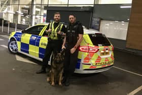 PC Ash Leach (left) with PC Matt Aris and police dog Bear outside Tesco