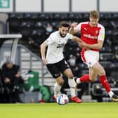 Michael Smith up against Derby County's Graeme Shinnie. Picture by Jim Brailsford