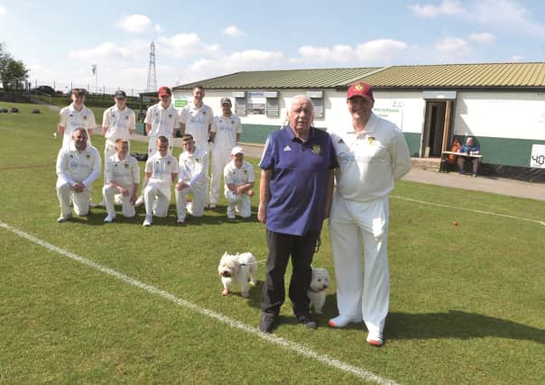 Upper Haugh captain Tim Whitehouse (front right) and head of cricket development Steve Sigsworth pictured with the team at Rawmarsh St. Joseph's Junior Football Club's ground.