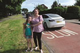 Rachel Carter with daughter Skyla who is petitioning for a new crossing on the busy Flash Lane ant Bramley. 220513-1