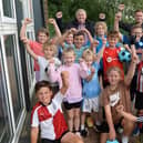 Youngsters who enjoyed a recent summer holiday multisports session at Kilnhurst Primary School, are pictured with local councillor Stuart Sansome (back left) and SJD sports coach Shaun Rockett.