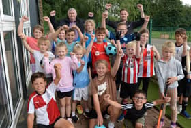 Youngsters who enjoyed a recent summer holiday multisports session at Kilnhurst Primary School, are pictured with local councillor Stuart Sansome (back left) and SJD sports coach Shaun Rockett.