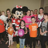 Fund-raiser Nadine Scott (pictured in pink T-shirt) organised a charity event for Breast Cancer Care on Saturday, with a special appearance by Minnie Mouse. 171134