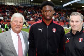 Joshua Kayode (centre) seen with Millers chairman Tony Stewart (left) and Garreth Barker
