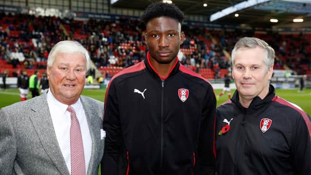 Joshua Kayode (centre) seen with Millers chairman Tony Stewart (left) and Garreth Barker