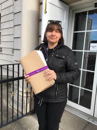Unison branch secretary Ruth Askwith takes the petition to Rotherham Town Hall