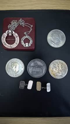 A picture of the mystery jewellery and coins, supplied by South Yorkshire Police