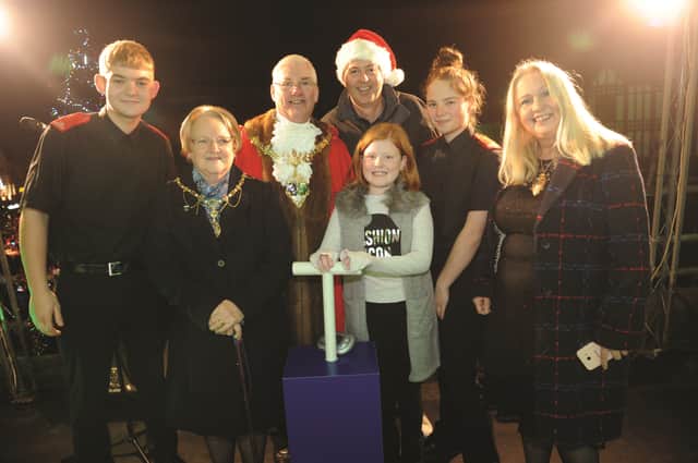 The mini Deputy Mayor, Olivia Hodges, pushes the switch to turn on the lights. Also pictured (from left to right) are, Korben Smith, Fire Cadet, The Mayor and Matyoress of Rotherham, Cllr and Mrs Alan Buckley, Rother FM breakfast DJ, Stewart Nicholson, Jorja Bailey, Fire Cadet and Deputy Mayor, Cllr Jenny Andrews. 184595-10