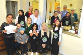 The launch of a new community cafe by TimeBuilders Rotherham took place at St Paul's Church at Masbrough recently, with members of the community coming together to cook and eat food donated by Food Cycle. Local residents who took part in the first community cafe are pictured with vicar Rev Phil Batchford (third from right), RotherFed's community organiser for Masbrough, Henley and Ferham Vicky Hilton (centre) and project leader Christine Batchford (back row, second from left). 184465