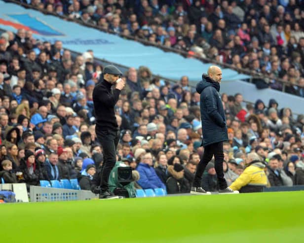 Paul Warne and Pep Guardiola. Picture by Dave Poucher
