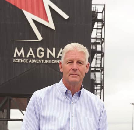 Seen outside MAGNA is new CEO, Kevin Tomlinson. 184115-6