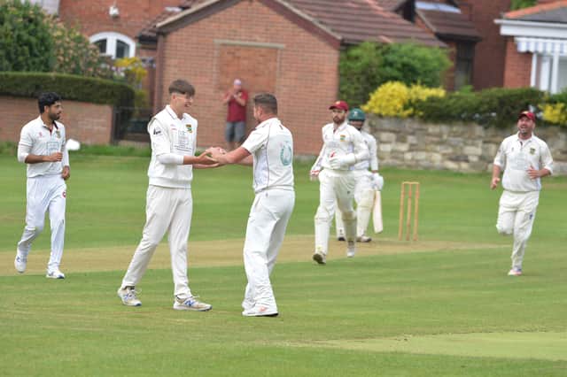 Whiston Parish Church celebrate a wicket in their league match at Conisbrough earlier this season.