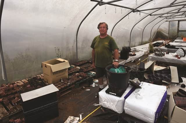 Proprieter, Richard Yeardley in one of the vandalised greenhouses. 220722-1