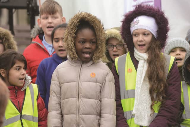 Pupils from St Ann's School sang the school's anthem 'Can You Hear My Voice?' in five different languages during the Holocaust Memorial event in All Saints' Square. 170135-6