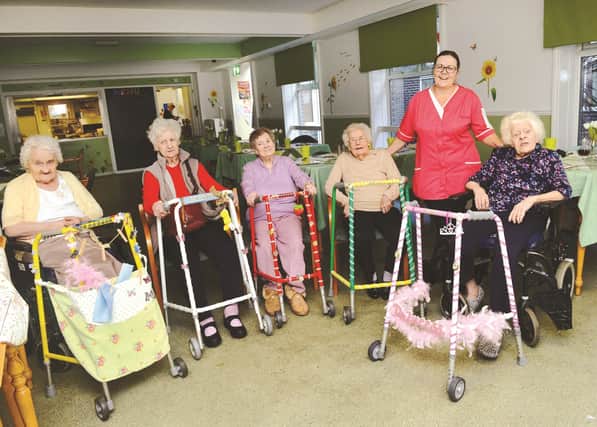 Dearne Lea Park residential care home activities co-ordinator Yvonne Lynman (second right) pictured with residents and their 'pimped' up zimmer frames, from left to right are: Dorothy Fowler, Margaret White, Shirley Lea, Phylis Parkes and Joan Schofield. 180139-1