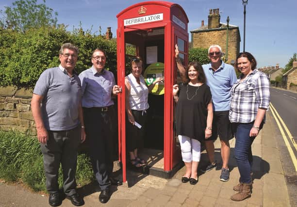 Wentworth Residents Association members at the telephone box on Main Street which is the new location for the defibrillator. From left to right are: chairman Paul Hunton, treasurer Keith Wigfield, secretary Joan Cook, Janice Middleton, Cllr Graham Cook and Abi Cox of Renewi Corporate Social Responsibilty Fund