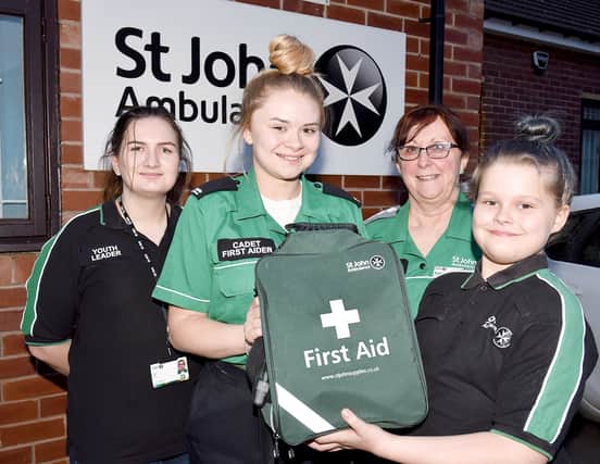 St John First Aiders, Evie (9) and Caitlin (16) Boulby (front), who put all their training in to practice when they stopped and helped treat people after they came across a road traffic accident in December. Also pictured is Rotherham St John Unit Manager, Rowena Clarkson (right) and Youth Leader, Elise Hall. 200367-1