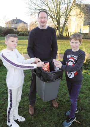 Talking rubbish-Brampton Ellis Primary pupils, Ashton Balint-Pratt (left) and Alex Harrison with taecher Andrew McLeavy who are appealing for some new recycling bins at the school. 201062-1