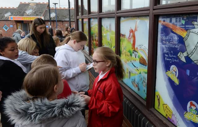 MP Ed Miliband officially unveiled new murals on the windows of Mexborough Library, which were created by author and artist Phil Sheppard with children from local schools.