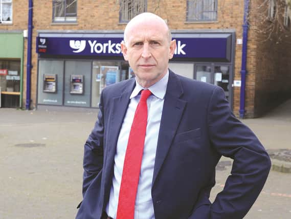 Wentworth and Dearne MP, John Healey, is seen outside the Yorkshire Bank in Wath, which is proposed to close. 170556-2